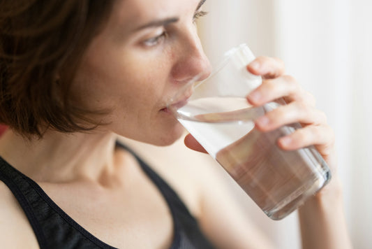 Woman drinking water from a glass