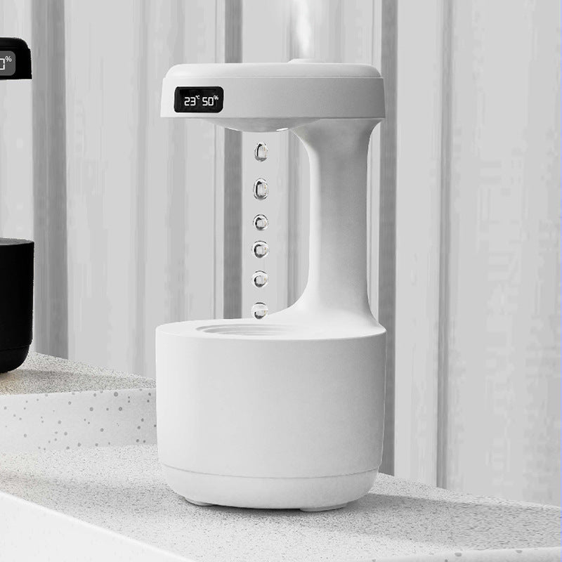 Fascinating humidifier with gravity defying water motion and integrated clock - Plenish