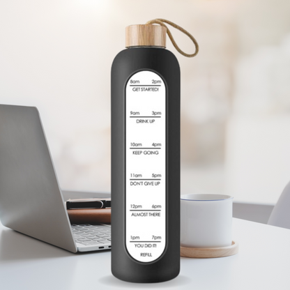 Glass bottle with non-slip protective sleeve and helpful time markers