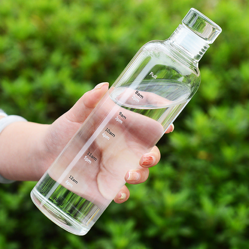 Stylish and minimalist glass water bottle with clever time markers - Plenish