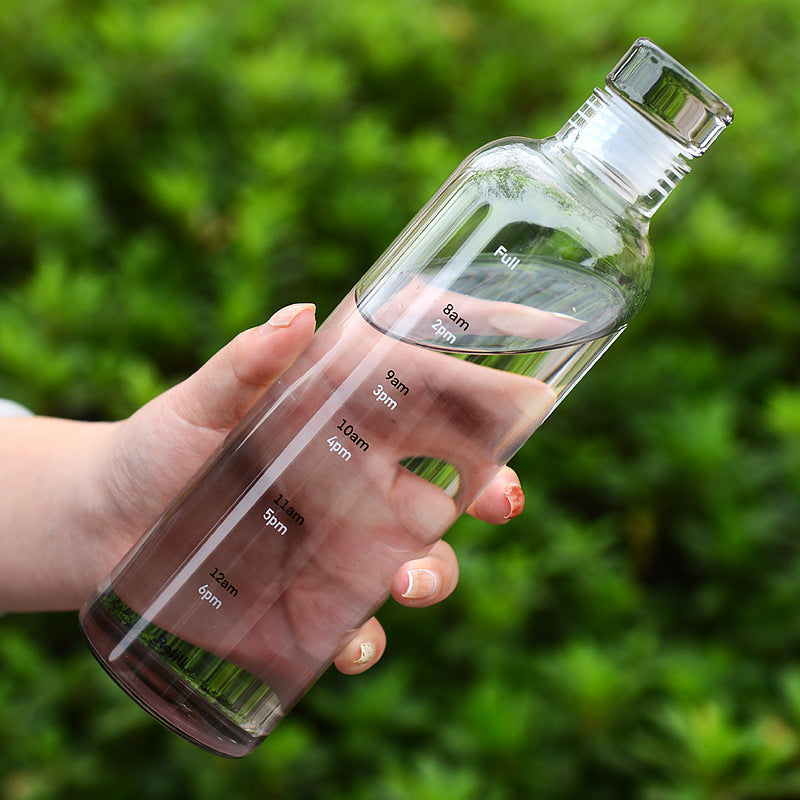 Stylish and minimalist glass water bottle with clever time markers - Plenish