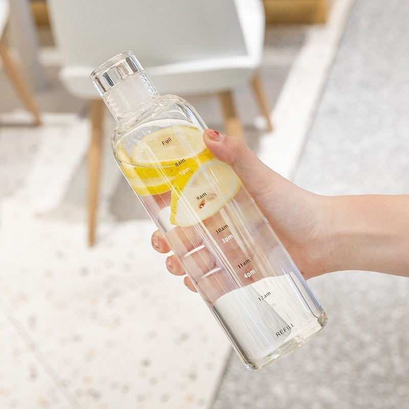 Minimalist and stylish glass water bottle with helpful time markers - Plenish